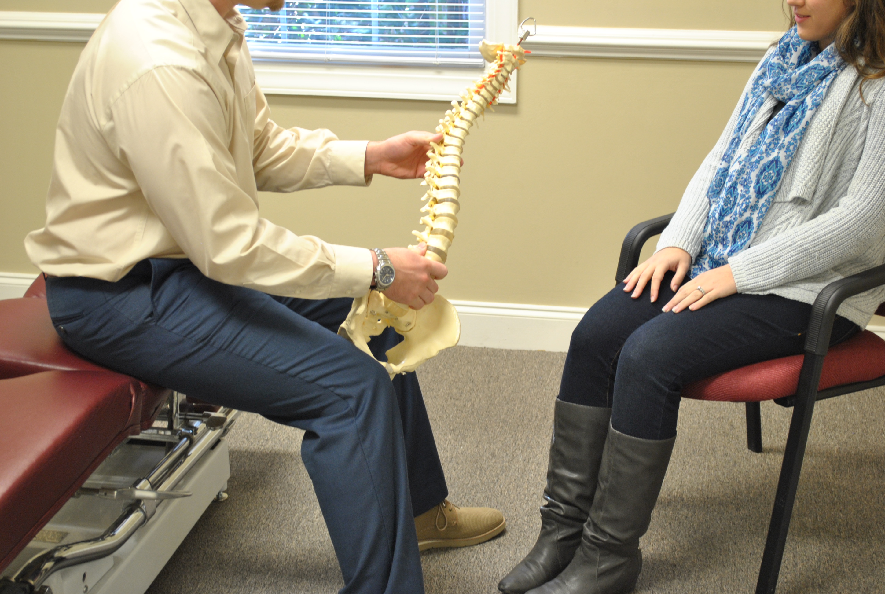 New Patient In Take session, Dr. Berry discussing the spine with a patient